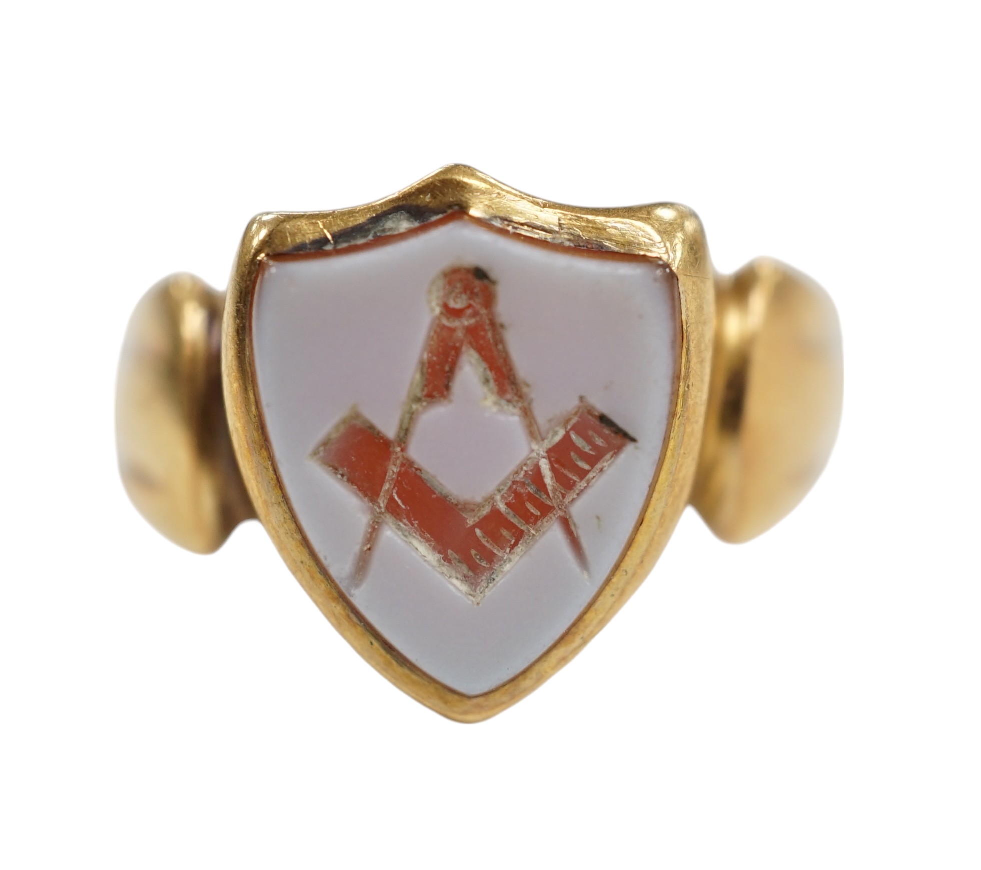 A late Victorian 18ct gold and sardonyx set shield shaped Masonic signet ring, size Q/R, gross weight 5 grams. Condition - fair